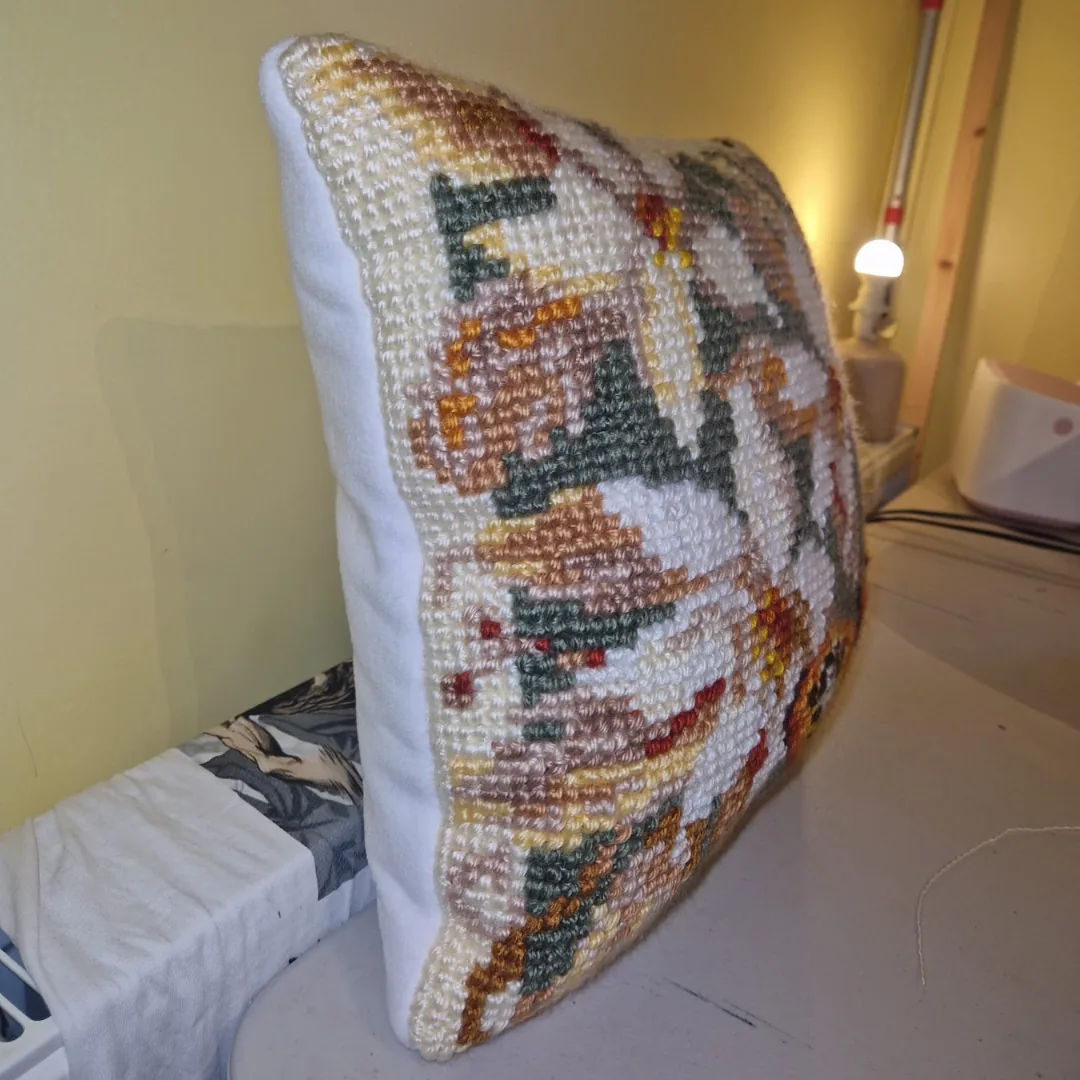 Memory cushion front made from a hand stitched floral tapestry panel with a soft white fabric back