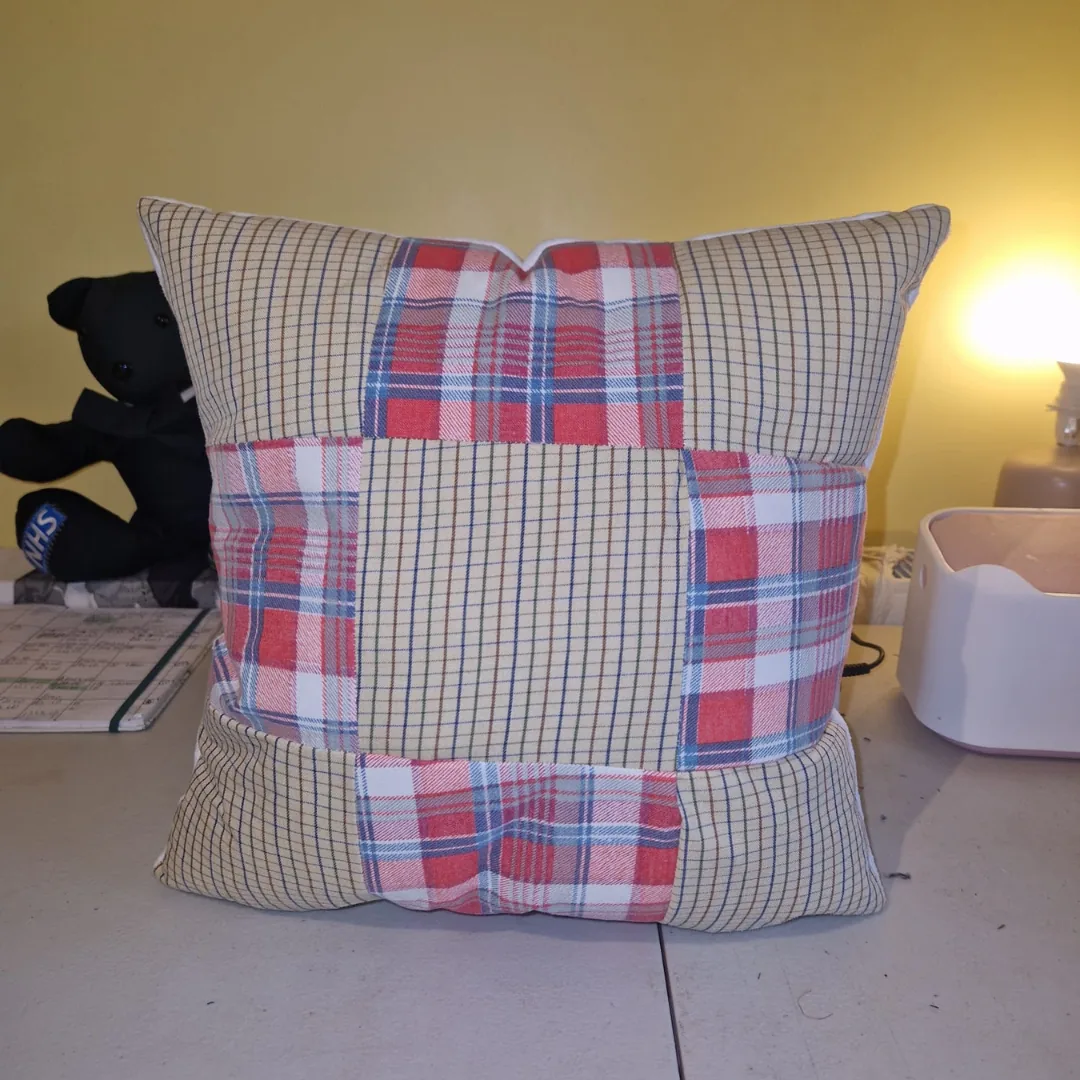 Patchwork memory cushion made from red and cream checked shirts