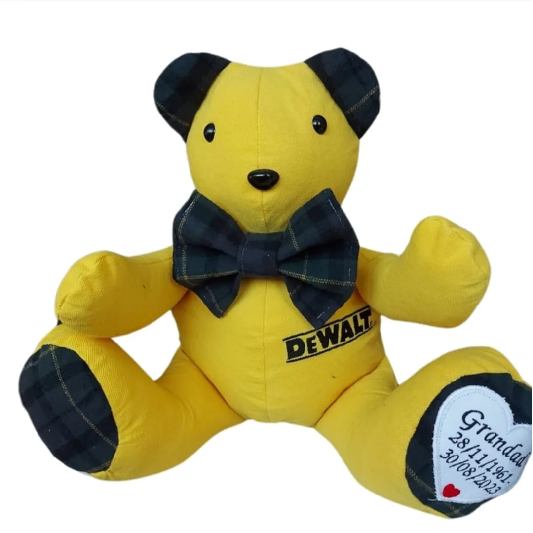 Memory bear made from a yellow work shirt with tartan ears and a heart embroidered with Grandad and his dates