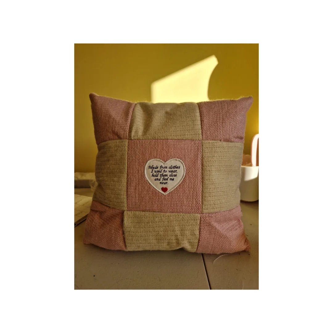 Patchwork memory cushion in soft pink and beige with an embroidered heart poem in the centre